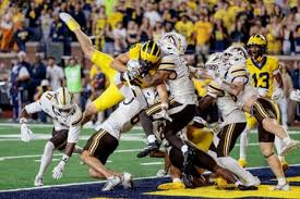 Michigan's last-gasp miracle by Bryce Underwood saves Whittingham debut from disaster - The New York Times