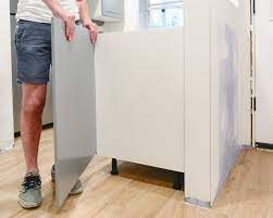 Ikea did make an island system and we have had good luck with it as long as the island is not over 4' long and 2' wide. Perfecting The Imperfect In Our Ikea Kitchen Fillers Panels Toe Kicks Yellow Brick Home