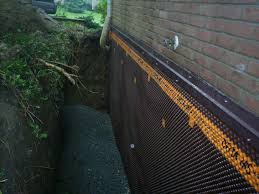 A trench is created to slope toward a drainage point. Exterior Basement Wall Waterproofing Waterproofing Basement Waterproofing Basement Walls Basement Walls