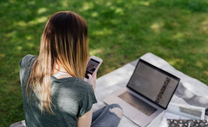 A freelancer working steadily on a laptop