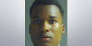 Teen turns himself in after pawn shop shooting, second suspect wanted