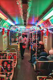 Holiday train run on the Red line yesterday, out chea taking elfies with my  man Gingerbread. [4000×6000][oc] : r/chicago