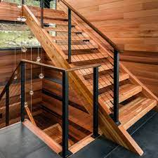 Additionally, oak treads and flooring are commonly used to complete the look. Black Cable Railing Berkshires Ma Keuka Studios