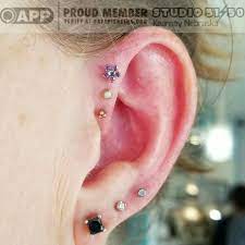 Healing Triplet From A Few Months Ago Today We Slipped That Brilliant Purple Flower Up Top For A Fun New L Forward Helix Piercing Helix Piercing Ear Piercings