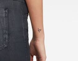 A reddit focusing on wrist tattoos: Music Wrist Tattoo Etsy