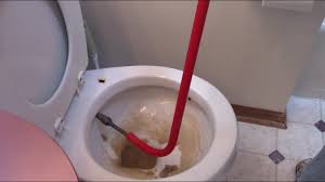 Use the toilets water supply to run down the pipe while snaking. Using A Toilet Auger Snake On A Clogged Toilet Youtube
