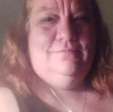 What can I plant in a mostly shaded area to climb up a trellis.