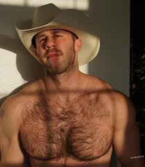 Leather-clad cowboys showing furry bottoms