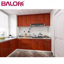 This modular kitchen design features a system that doubles as furniture to fit in the available space. China Red Melamine Classic Simple Design Modular Kitchen Cabinets Red Melamine Classic Simple Design Modular Kitchen Cabinets Manufacturers Red Melamine Classic Simple Design Modular Kitchen Cabinets For Sale