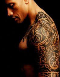 Dwayne johnson 's bull tattoo on his right bicep has become the star's signature ink since his early pro wrestling days. Dwayne Johnson Tattoo The Rock Samoan Tattoo Meaning