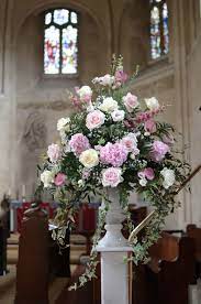 Maybe you would like to learn more about one of these? Traditional Pedestal Arrangement In Shades Of Pink In A White Urn Vase Large Flower Arrangements Large Floral Arrangements Flower Arrangements