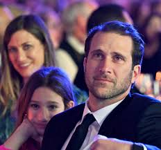 Celebrating St. Joseph's Day With An Image Of A Proud Father Listening To  His Mother & Father