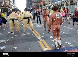May 19, 2012 - San Francisco, CA, USA - Nude Bay to Breakers runners and  costumed Sumo wrestlers participate in the 2012 Bay to Breakers on May 20,  2012 in San Francisco,