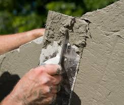 To apply stucco to an existing brick, block, or concrete wall, first brush a concrete bonding agent onto the wall, then allow it to dry completely. Products Sakrete
