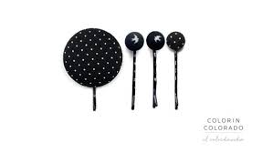 Flower hair clip available in styles and embellishments that complement any outfit, giving an exclusive touch or whimsy of elegance. Mini Hair Clips With White Flower Black Leaf On Grey