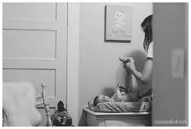 I M Sure This Mom Feels Like This Is The Millionth Diaper Change She S Done This Week Mom And Baby Documentary Family Photography Photography Mom And Baby