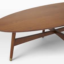 Top made of carrara marble veneer over engineered wood. Reeve Mid Century Oval Coffee Table Pecan