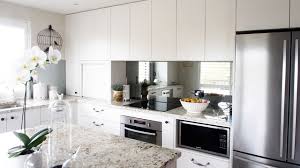 Put one behind your stove. 20 Beautiful Kitchens Incorporating Mirrors