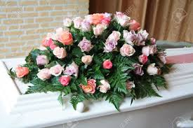 Diy closed casket mixed flowers arrangement.materials used:50 mixed colors roses5 white hydrangea 20. White Casket Covered With Floral Arrangements At A Funeral Service Stock Photo Picture And Royalty Free Image Image 11194227
