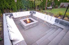 For a sunken pit, you will want to line the bottom with gravel to ensure water has someplace to go—you don't want your fire pit turning into a bird bath. Backyard Features Paradise Restored Landscaping