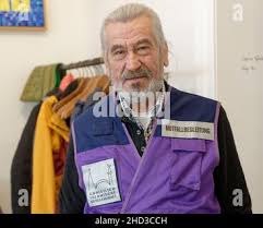 Cologne, Germany. 17th Dec, 2021. Boxer-dog-mix Odett stands in front of  the Konrad Adenauer animal shelter. (to dpa: "Animal rights activists: In  pandemic even more so no animals for Christmas") Credit: Henning