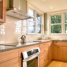 Blue marble countertops with a sheer of marble and gold would look great with cream or gold toned tiles. I Like The Tile And Wood Finishes Is The Countertop Dated I Still Like It Maple Kitchen Cabinets Country Kitchen Tiles Country Kitchen Tile Backsplash