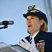 Capt. Meredith L. Austin (center), commander of Coast