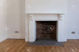 Maybe you would like to learn more about one of these? Victoriran Wooden Fireplace Surround With White Walls Stock Photo Picture And Royalty Free Image Image 99242412