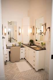 Whether you want to organize toiletries and bath amenities or fill that empty corner space in the bathroom to maximize storage space, getting a stylish corner vanity is an excellent choice. Corner Bathroom Cabinets With Eclipse Wall Lights Transitional Bathroom