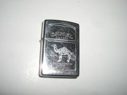 Same cigarette as the unfiltered camels, just in the 50's when cigarettes were proved to cause cancer, comapanies started to add filters to their cigarettes to filter some of the toxins out of the smoke. Vintage Very Old Inscribed Camel Filters Lighter Stamped Zippo F Xi Made In Usa Has Really Nice