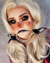 Her face is painted to look like a sack like you would see on a scary scarecrow and the artist has added patches, stitches and more. 45 Scarecrow Makeup Ideas For Halloween Stayglam
