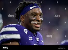 Kansas State Wildcats defensive end Meshak Williams (42) sacked Kansas  Jayhawks quarterback Jordan Webb (2) in the first quarter. Kansas State  University defeated the University of Kansas, 59-21, at Kansas University  Memorial