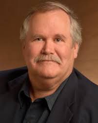 Environmental stress mediates groundwater microbial community assembly