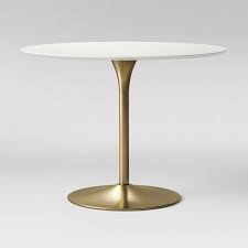 If your decor is stainless steel, opt for a coffee table with legs in the same finish. Braniff Round Dining Table Metal Base Brass Project 62 In 2021 Round Dining Table Metal Dining Table Brass Dining Table
