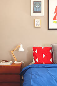 A silver ornate mirror mounted on the beige wall faces the leather bed in this primary bedroom. How To Fight The Rental Battle Of The Beige In Every Room In The House Master Bedrooms Decor Bedroom Decor Cozy Bedroom Lighting