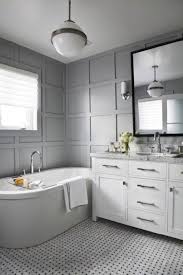 A farmhouse bathroom by dv rasmussen construction gets a chic touch with a subtle marble herringbone tile floor. What Looks Good With Carrara Marble