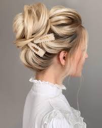 A wide variety of bun. The Most Gorgeous Textured High Bun For Brides On Their Wedding Day The Gorgeous Oversized Pearl Hair Clips Make This W Clip Hairstyles Hair Styles Hair Clips