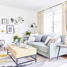 The floral sofa and the green lucite coffee table are a welcome surprise that break up the classic elements without overshadowing them. How To Furnish A Living Room Living Room Design Ideas