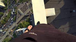 Parkour Runner Misses Jump And Falls Off High Rise Roof, Catches Himself On  Electric Wires - YouTube