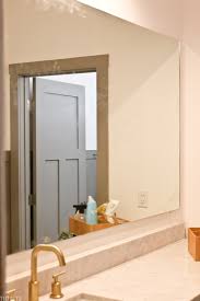 Immediately, place the board on the mirror. Diy Wood Mirror Frame For Bathroom Vanity Tidbits