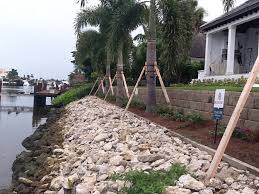 Protects seawall footings from undermining. Rip Rap Garland Marine Construction