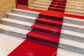 Marble stairs radiate sophistication no matter where they are located.we find them in luxury residences, hotels, shopping centers, museums, and marble stairs cannot be missing in any design that has good taste as a priority. White Marble Staircase With A Red Carpet Stock Photo Picture And Royalty Free Image Image 97206545