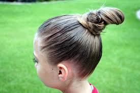 Cheer hairstyles are so fun to do for young girls. High Cheer Bun Updo Hairstyles Cute Girls Hairstyles