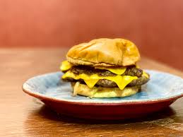 Truffle mushroom & swiss burger with a fried egg. Quarantine Kitchen Double Smash Burgers With Bonus Whiskey Onions