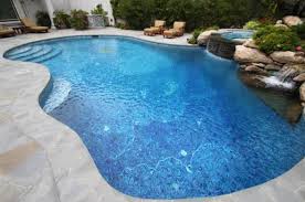 We offer the largest selection of above ground swimming pools for your family. 10 Freeform Pools That Perfectly Adapt To Your Landscape Indoor Outdoor Pool Freeform Pools Inground Pool Designs