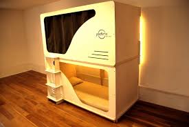 A sleeping pod looks like something coming from the future. Sleeping In A Bunk Bed Capsule Is Like Being In A Grave Ess Universal