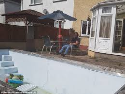 Cardiff father transforms hole in his garden into pool