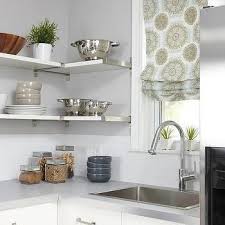 An island with a wood counter was added for additional storage and workspace in this white kitchen. Ikea Ekby Mossby Shelf Transitional Kitchen Transitional Decor Bedroom Transitional Decor Cabinet Design