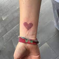 This Crazy Cool Tattoo Trend Doesn T Even Look Real Red Heart Tattoos Heart Tattoo Wrist Stitch Tattoo
