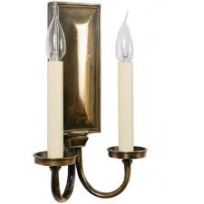 A contemporary styled pillar candle wall sconce. Georgian Twin Wall Sconce In Light Antique Finish With 2 Candle Lights